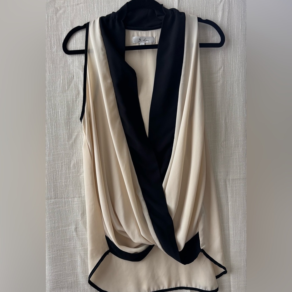 Elegant Black and Cream Sleeveless Blouse